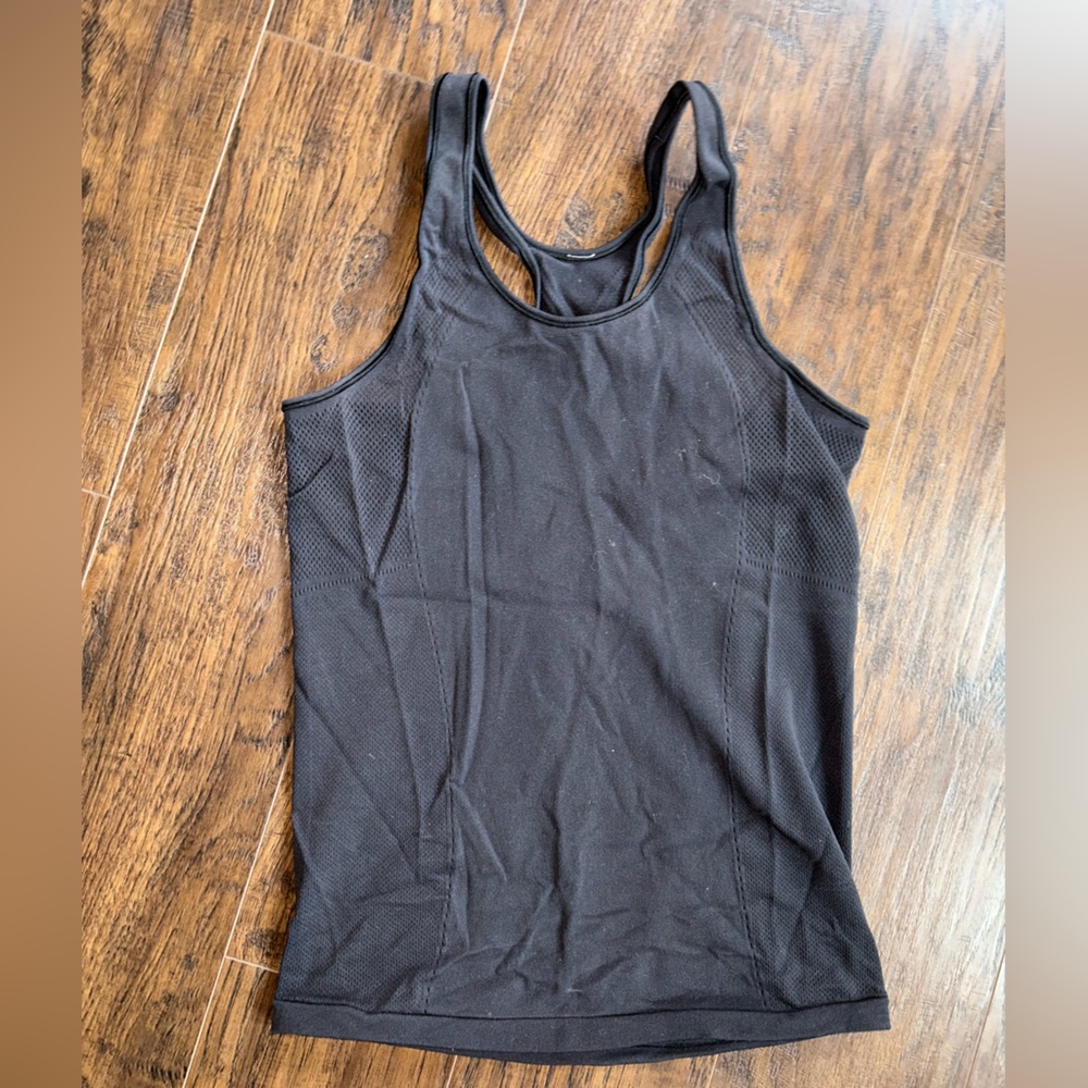 Lulu lemon black racer back mesh tank. Lightly worn.